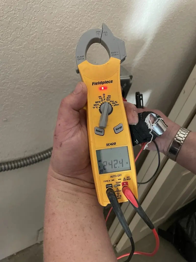Voltage testing with clamp meter during Recessed Lighting Installation in Sherwood